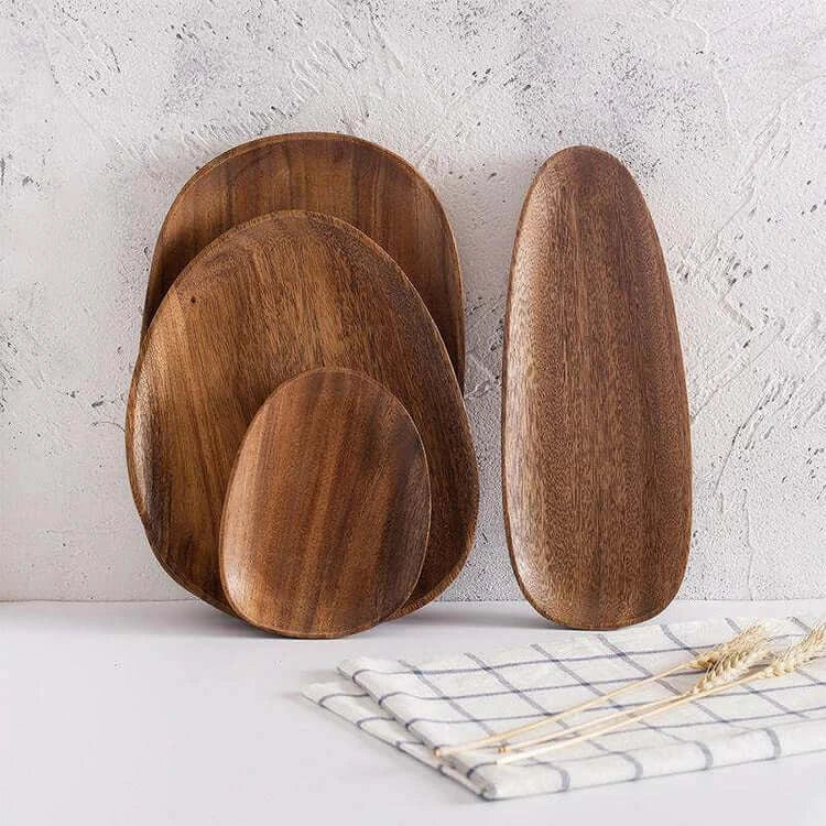 Irregular acacia wood trays with unique shapes and rustic charm, showcasing natural grain and warm tones.