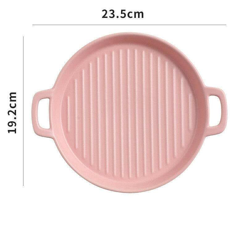 Pink bakeware with handles, 23.5cm diameter, oven and microwave safe, ideal for baking.