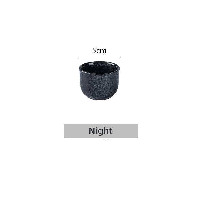 Japanese Sake Glass Ceramic cup, minimalist black design.