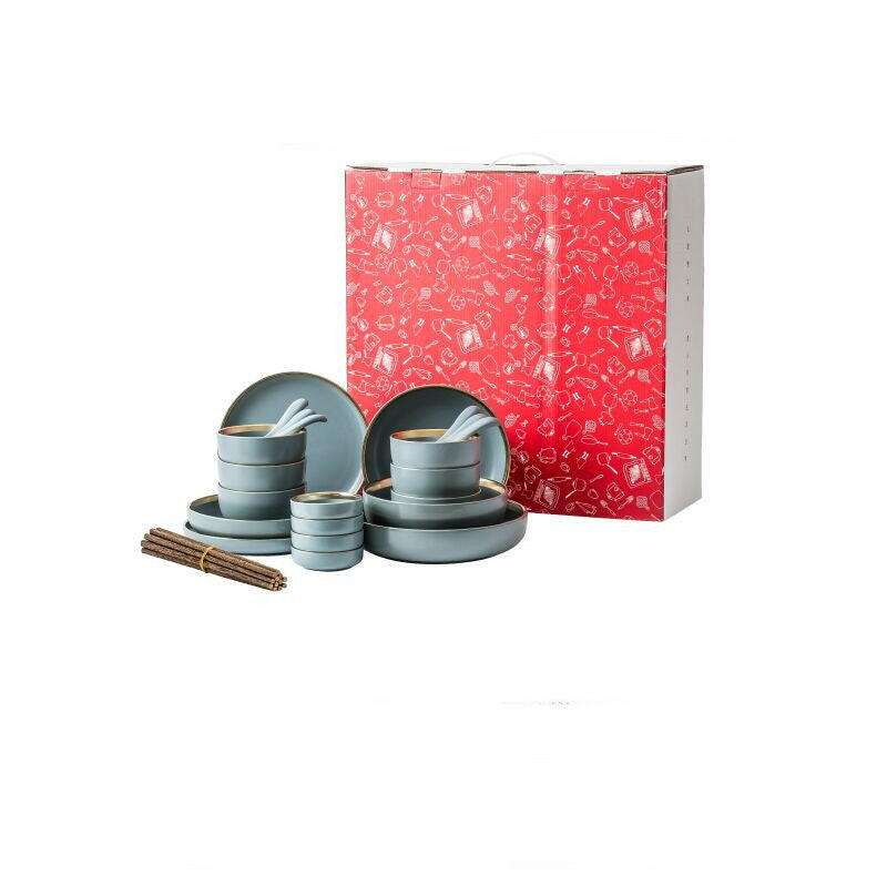 Ceramic tableware set with plates, bowls, and mugs in red box.