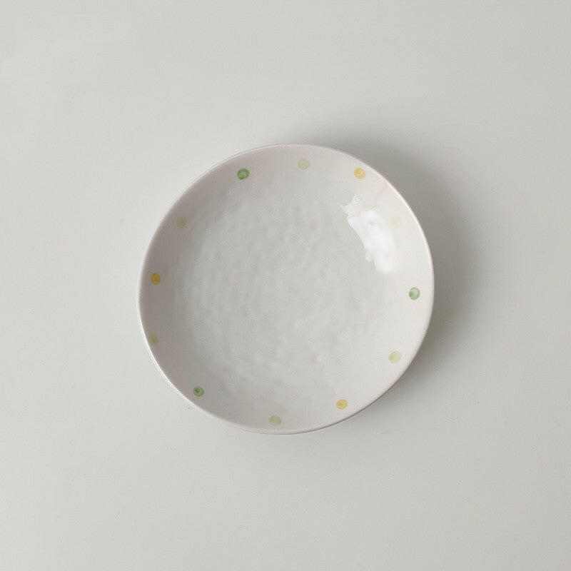 Porcelain Dinnerware Elegant dinner plate with subtle dot accents.