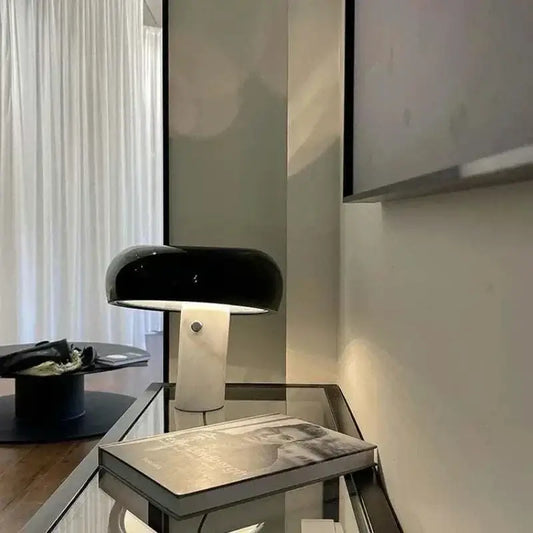 Eclipse Lamp with mushroom-shaped design and minimalist white base, offering contemporary style in black shade.