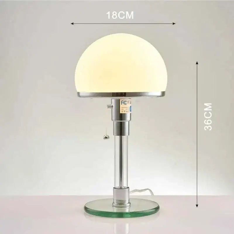 Bauhaus Table Lamp with dome-shaped shade on sleek metal stand and glass-like base.