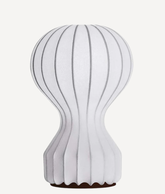 Abstract gourd-shaped paper lamp with vertical grooves and dark base, enhances modern decor.