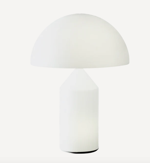 Table Lamp Atollo with minimalist design and cylindrical base.