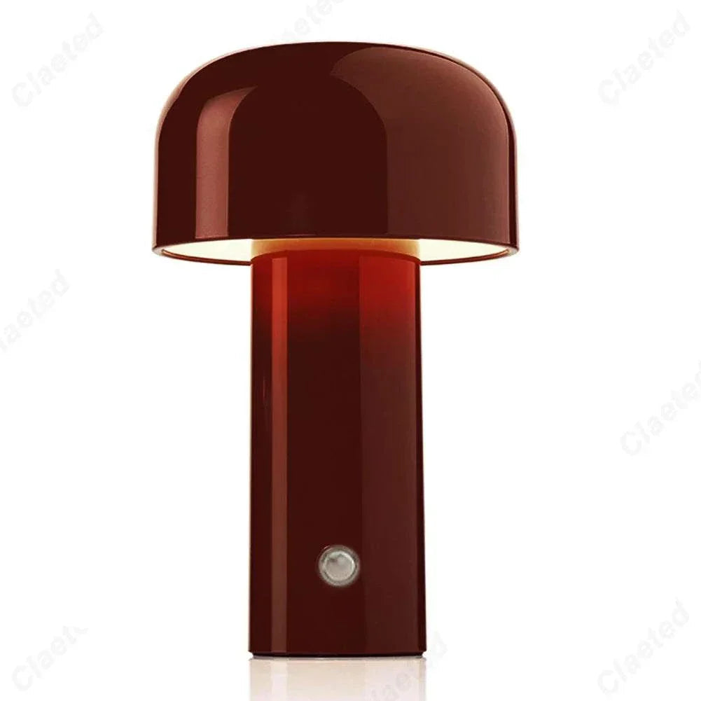Red rechargeable portable table lamp with minimalist dome design, ideal for modern decor.