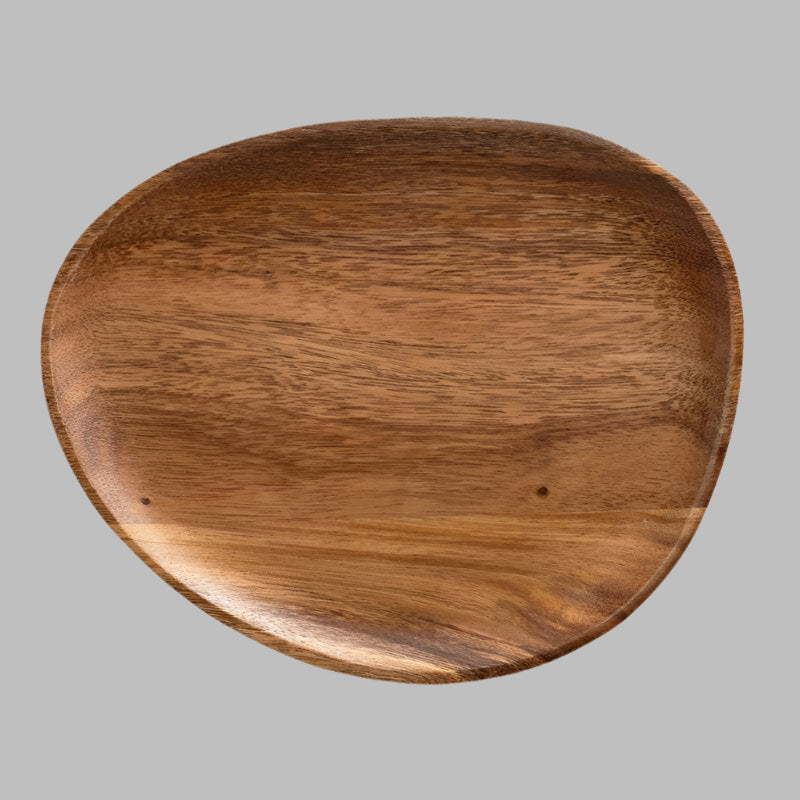 Irregular acacia wood tray with unique grain pattern and organic shape, measuring 26x21 cm.