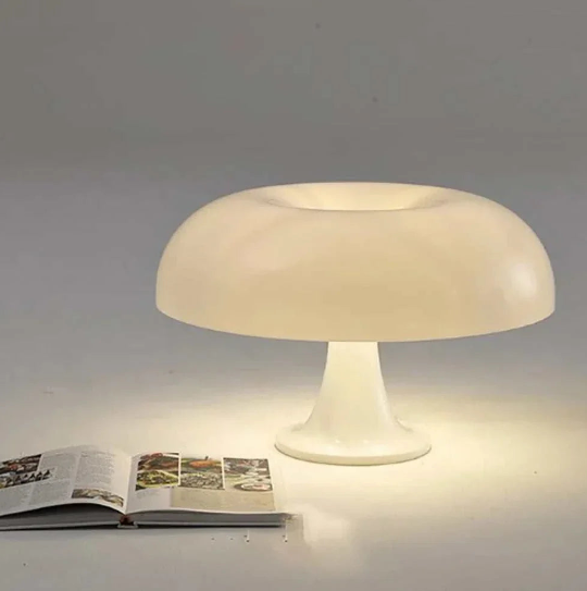 Mushroom Table Lamp with rounded top and dome design on table near window.