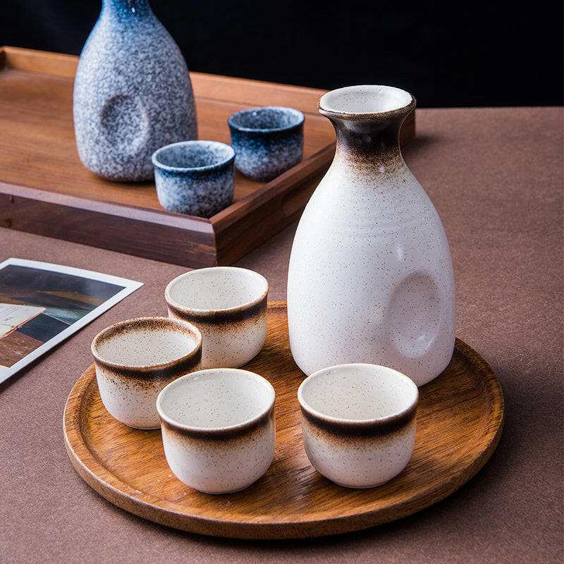 Japanese sake glass ceramic set with traditional design.