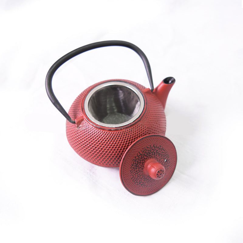 Red Teapot Set with intricate dotted design and black handle.