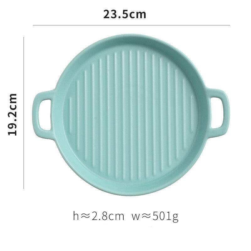 Aqua ceramic bakeware plate with handles, 23.5cm diameter, showcasing ridged surface for baking.