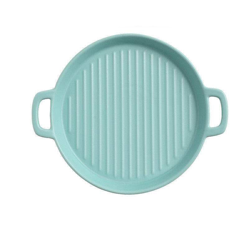 Aqua ceramic bakeware plate with handles, 23.5cm diameter, showcasing ridged surface for baking.