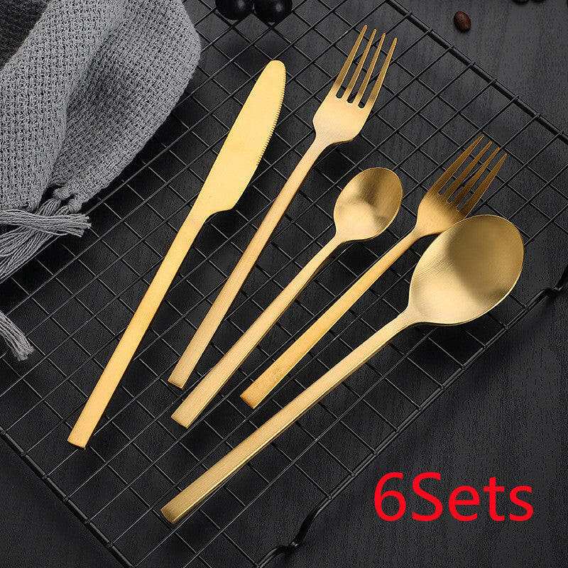 Matte stainless steel gold cutlery set on display, includes knife, fork, spoon, and teaspoon, set of 6.