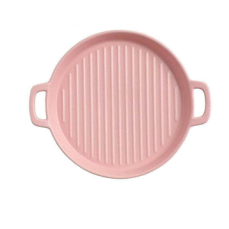Pink bakeware with handles, 23.5cm diameter, oven and microwave safe, ideal for baking.