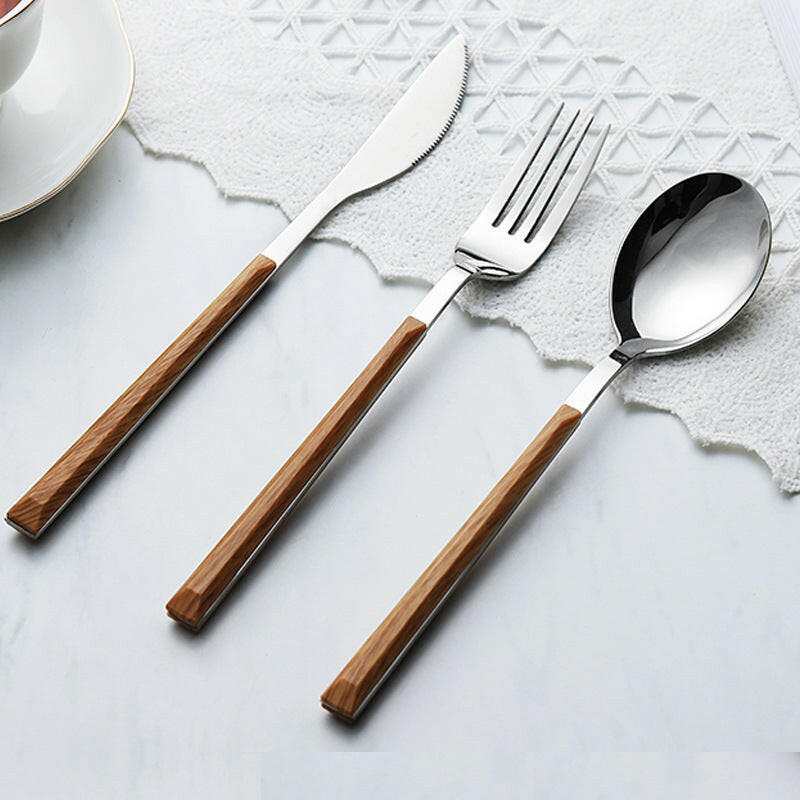 Stainless steel and wooden cutlery set with ergonomic wooden handles.