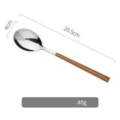 Stainless steel and wooden spoon with ergonomic handle.