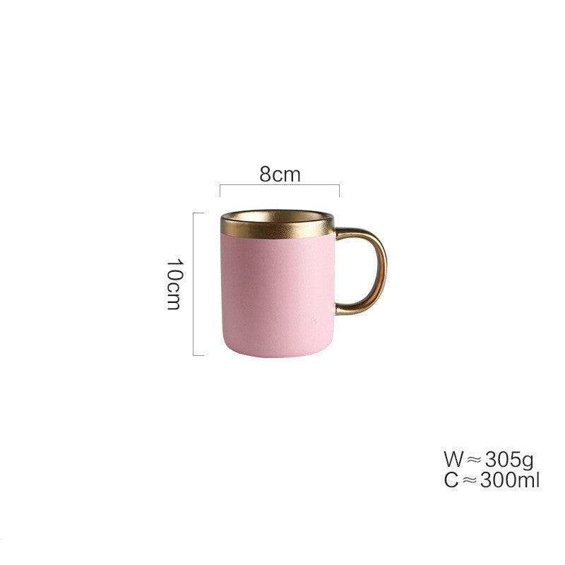 Pink Mood ceramic mug with gold accents, 10cm tall and 300ml capacity.