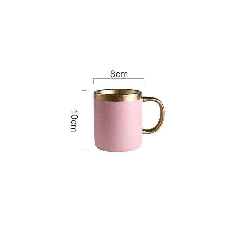 Pink Mood ceramic mug with gold accents, 10cm tall and 300ml capacity.