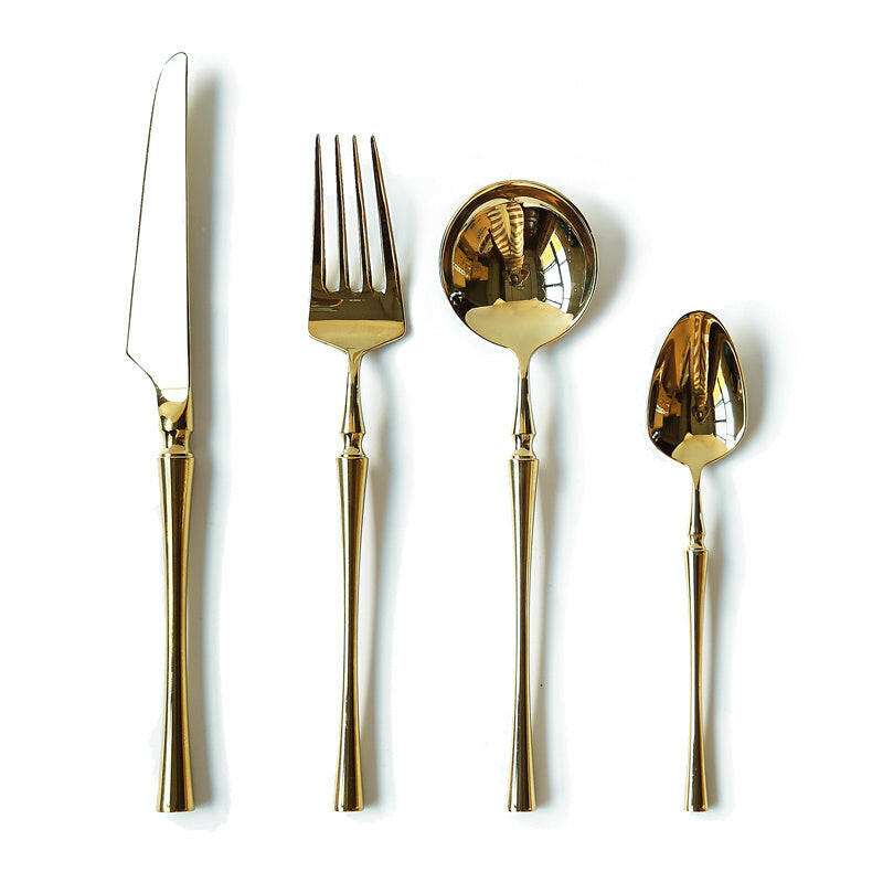 Exquisite stainless steel cutlery set with gold finish.