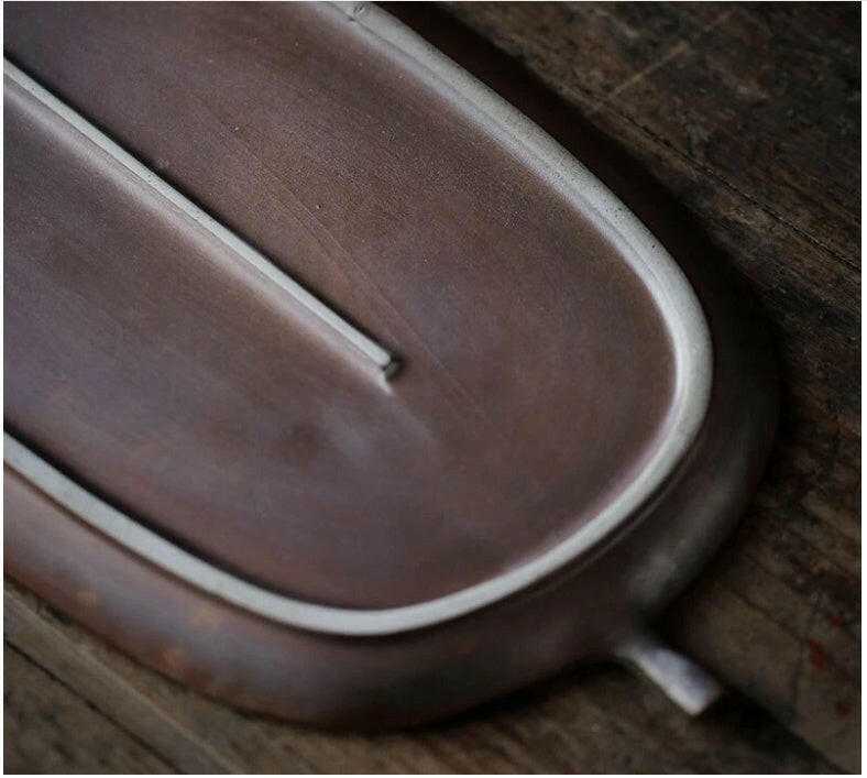 Vintage ceramic tea tray with delicate craftsmanship and aged glaze.