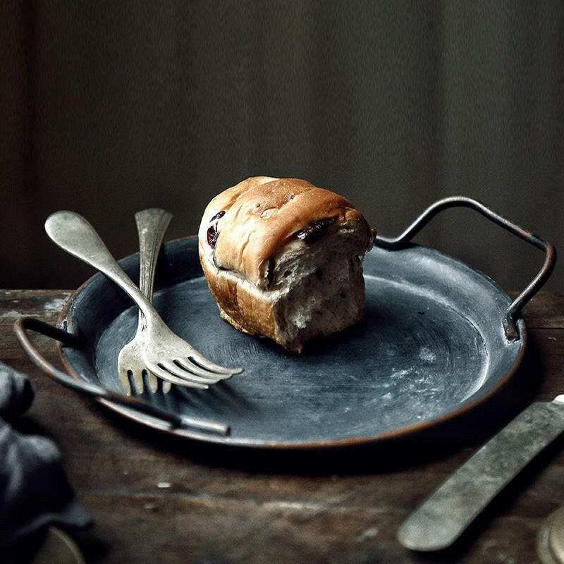 Vintage iron tray with rustic charm and weathered patina, perfect for serving or decor.