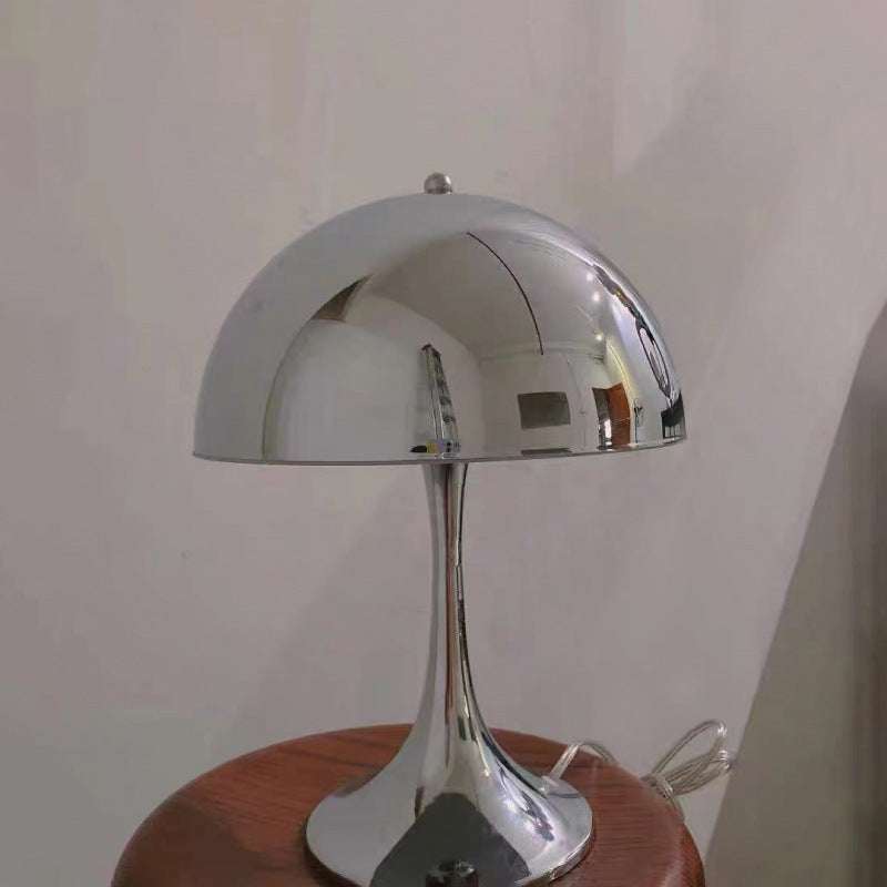 Modern Light - Iconic Danish Lamp with sleek silver finish on wooden table.