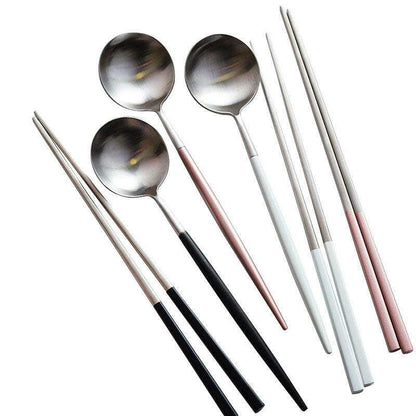 Stainless steel sushi cutlery set with chopsticks and spoons.