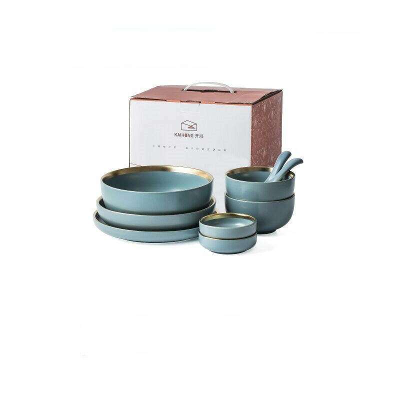 Ceramic tableware set with plates, bowls, and mugs, in a stylish design.