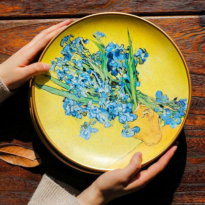 Hand-painted ceramic plate featuring Vincent Van Gogh's iconic oil painting of vibrant blue irises on a yellow background.