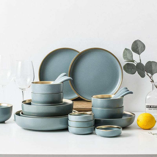 Ceramic tableware set for dining with plates, bowls, and mugs, showcasing a modern design.