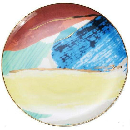 Colorful porcelain plate with hand-painted abstract design in blue, red, and yellow hues.