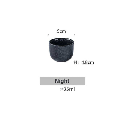 Japanese Sake Glass Ceramic cup, minimalist black design.