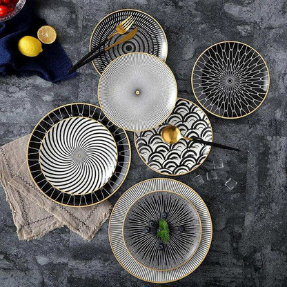 Modern geometric series ceramic dishes with intricate black and white patterns, featuring circles and spirals.