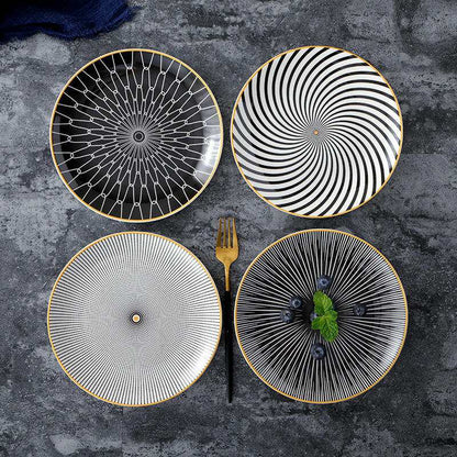 Geometric series ceramic dishes with intricate patterns in black and white.