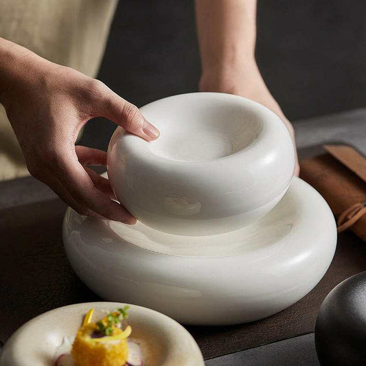 Ceramic Dinnerware Sets Modern, elegant white ceramic dishes for fine dining and serving.