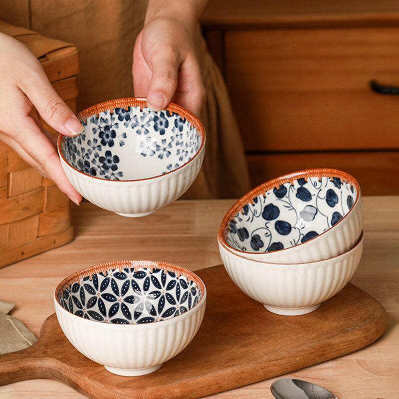 Retro box with ceramic bowls featuring vintage patterns.