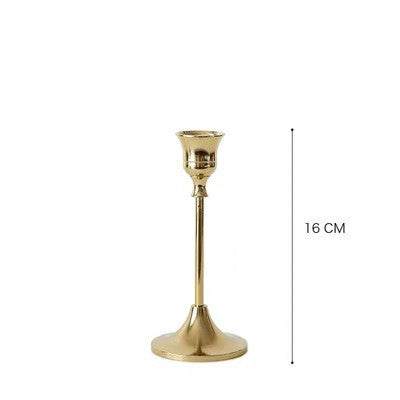 Vintage golden candle holder with elegant design and shiny finish, 16 cm tall.