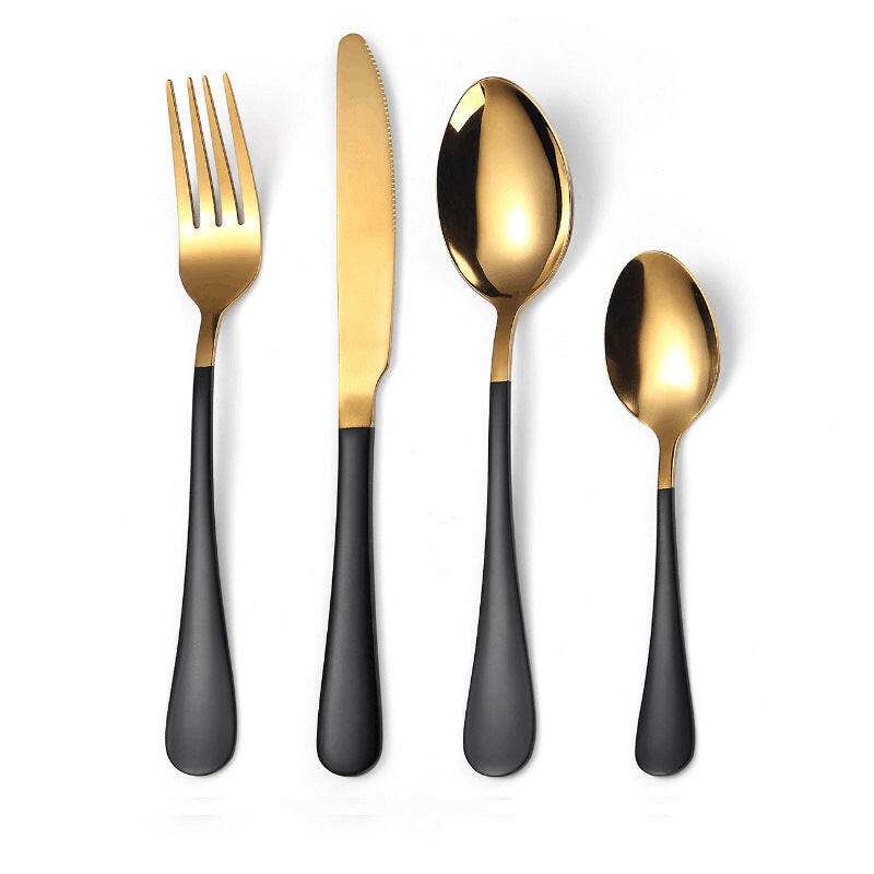 Stylish everyday cutlery set with black handles and gold utensils, including fork, knife, tablespoon, and teaspoon.