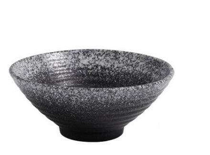 Japanese ceramic ramen bowl with speckled glaze, designed for heat retention and enhancing dining experience.