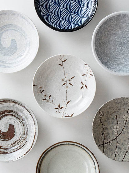 Retro Japanese ceramics featuring unique designs and textures in a ceramic plate collection.