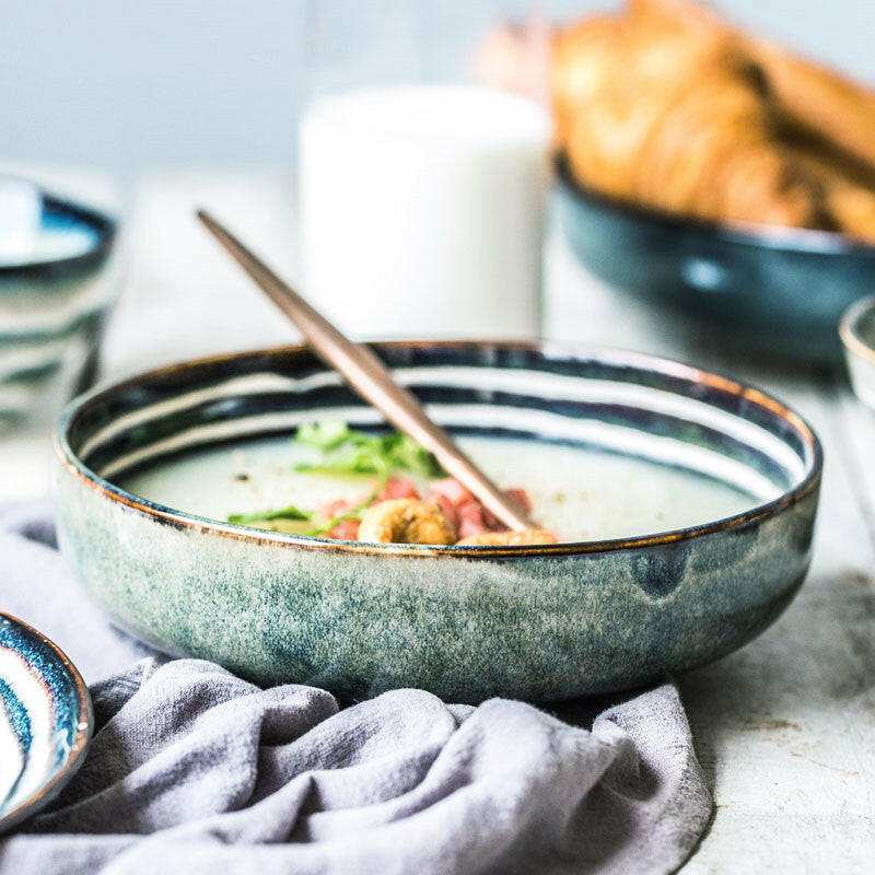 Porcelain Bowls Silver with spoon, displaying elegant craftsmanship and smooth texture.