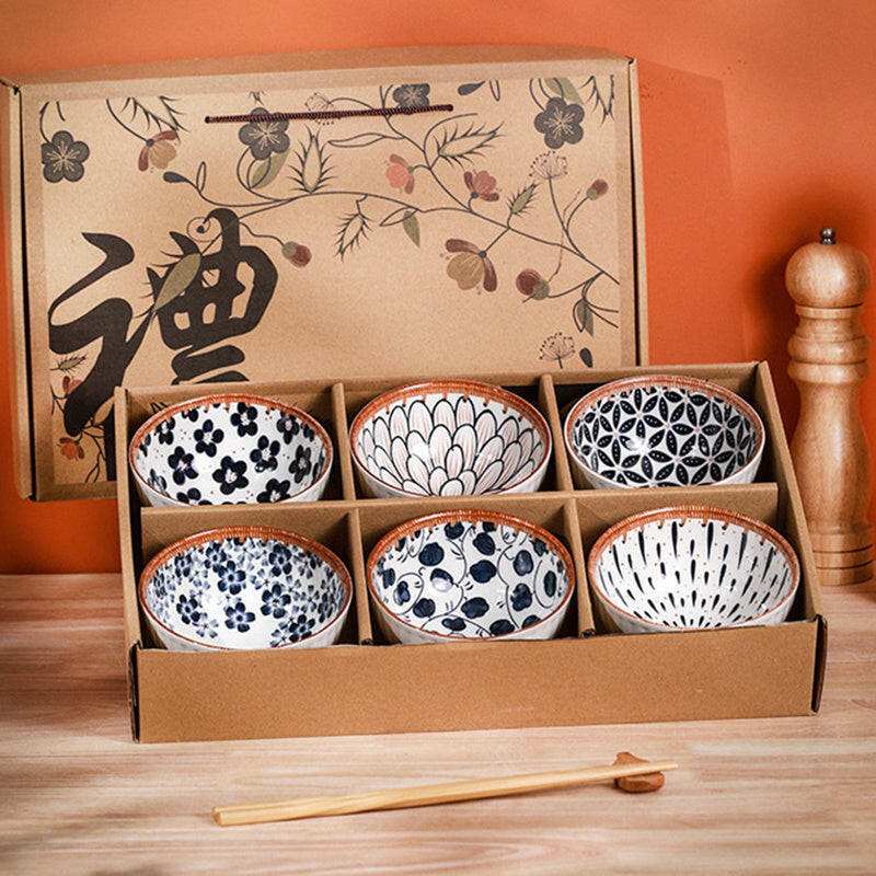 Retro box with vintage ceramic bowls featuring nostalgic patterns.