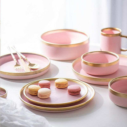 Pink Mood dining set with plates, bowls, and mugs, ideal for adding elegance and color to dining spaces.