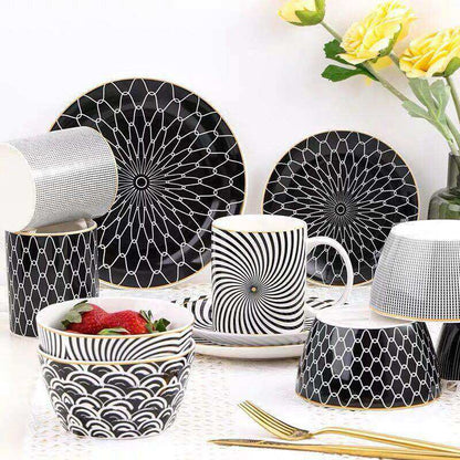 Modern geometric ceramic dishes with intricate black and white patterns.