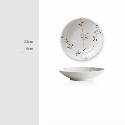 Retro Japanese Ceramics – Elegant ceramic plate with unique floral design, perfect as wall art or table decor.