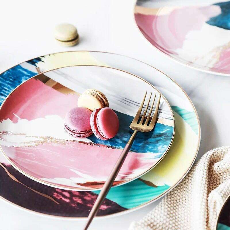 Colorful porcelain hand-painted with vibrant abstract patterns and macaron accents on a glossy ceramic finish.