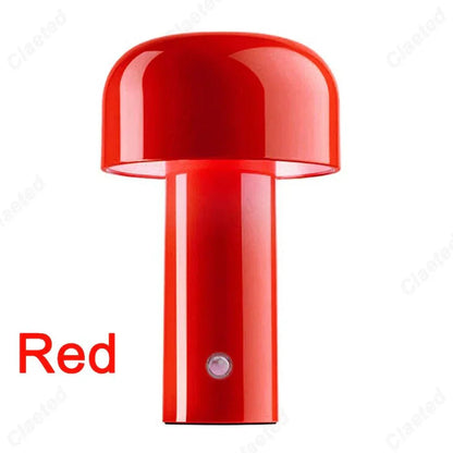 Red rechargeable portable table lamp with glossy finish and minimalist design.