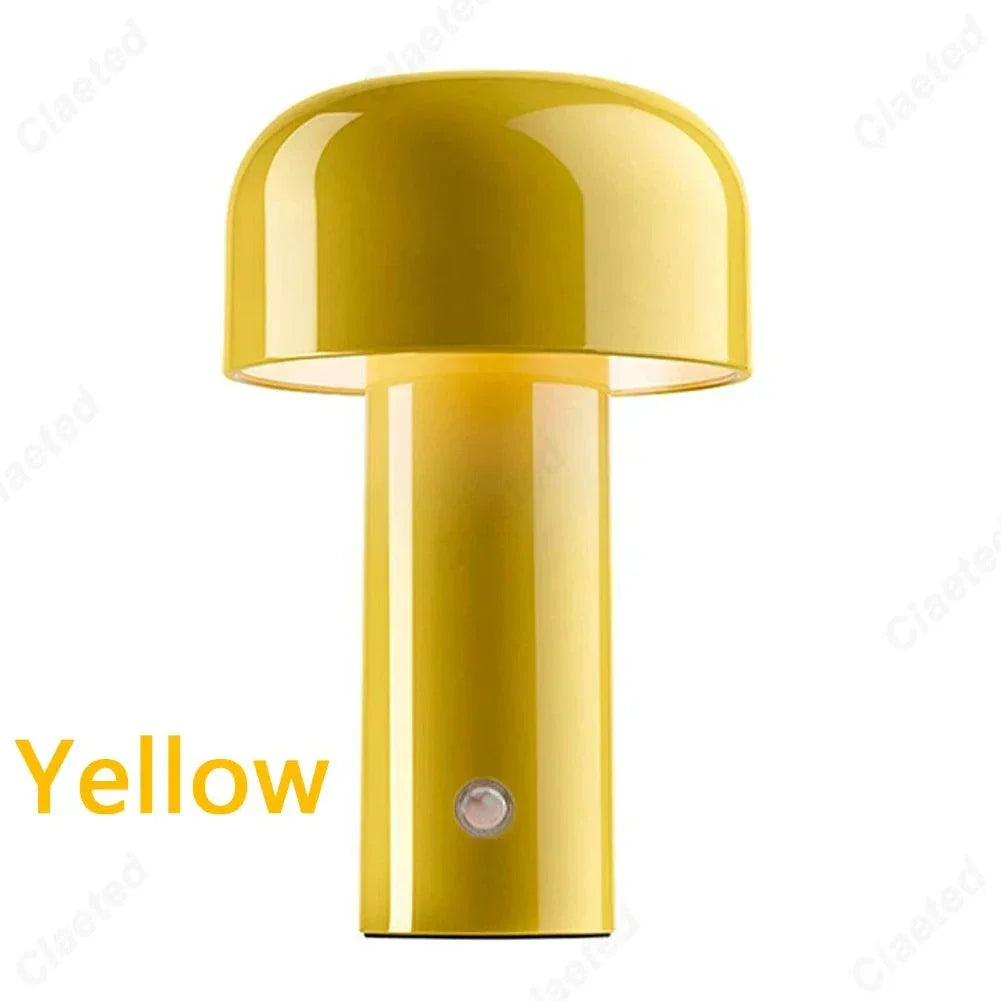 Yellow rechargeable portable table lamp with glossy finish and minimalist design.