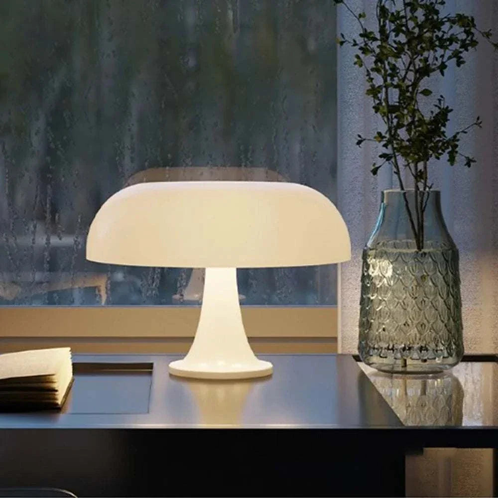 Mushroom Table Lamp with rounded top and dome design on table near window.