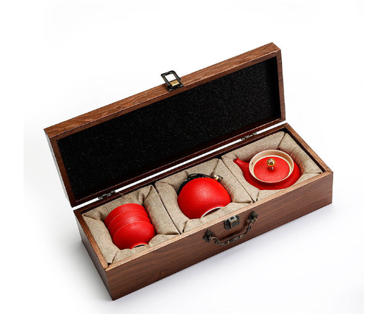 Traditional Japanese tea set with teapot and cups in elegant wooden box.